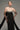 Black crystal-embellished corset maxi dress with sculpted bodice and detachable train - IHF STUDIO