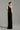 Black taffeta column gown with asymmetric white shoulder bow and delicate crystal embellishments - IHF STUDIO