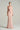 Light pink shimmer jersey maxi dress with twisted waist drape and crystal-embellished neckline - IHF STUDIO