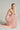 Light pink shimmer jersey maxi dress with twisted waist drape and crystal-embellished neckline - IHF STUDIO