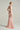 Light pink shimmer jersey maxi dress with twisted waist drape and crystal-embellished neckline - IHF STUDIO