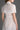 White Architectural Lace Bustier A-Line Dress With Mini Cape And Crystal Embellishment - IHF STUDIO