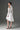 White Floral Vine Lace Mini Mullet Dress With Halter Neck And Long Sleeves - IHF STUDIO