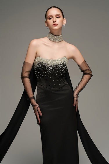 Black crystal-embellished corset maxi dress with sculpted bodice and detachable train - IHF STUDIO