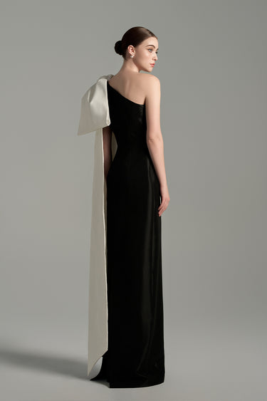 Black taffeta column gown with asymmetric white shoulder bow and delicate crystal embellishments - IHF STUDIO