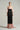 Strapless silk taffeta midi dress with blush pink bodice, black skirt and oversized crystal bow train - IHF STUDIO