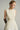 Ivory A-line taffeta midi dress with crochet lace overlays and crystal-embellished bow neckline - IHF STUDIO