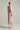 Light pink crepe bodycon midi dress with deep V-neckline and crystal embellishment - IHF STUDIO